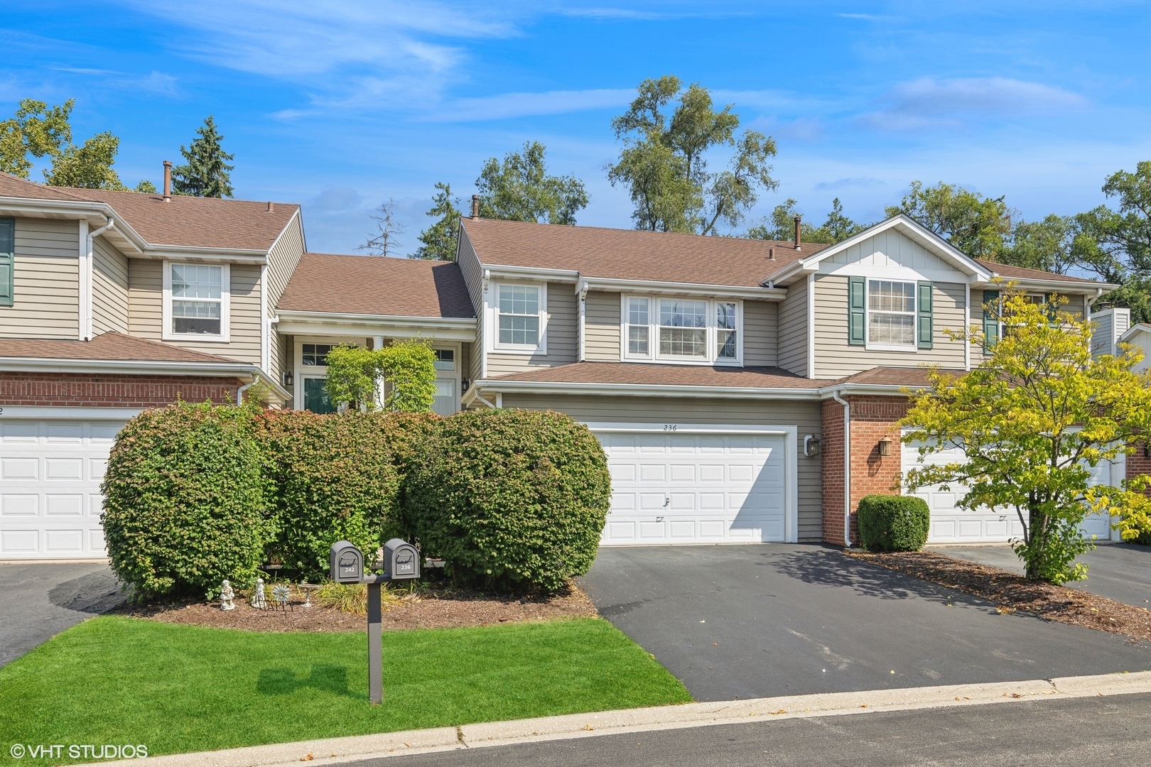 front view of a house with a yard