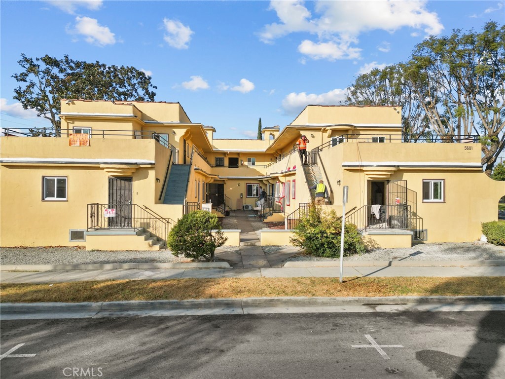 a front view of a house with a view of a building