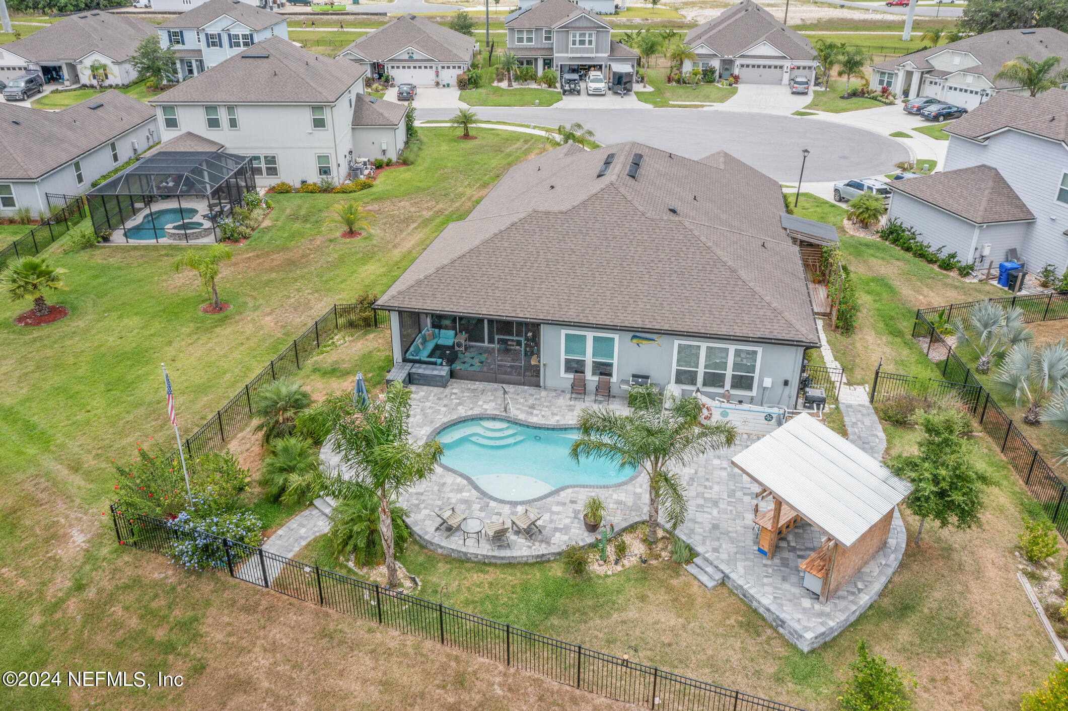 an aerial view of a house with outdoor space patio and lake view