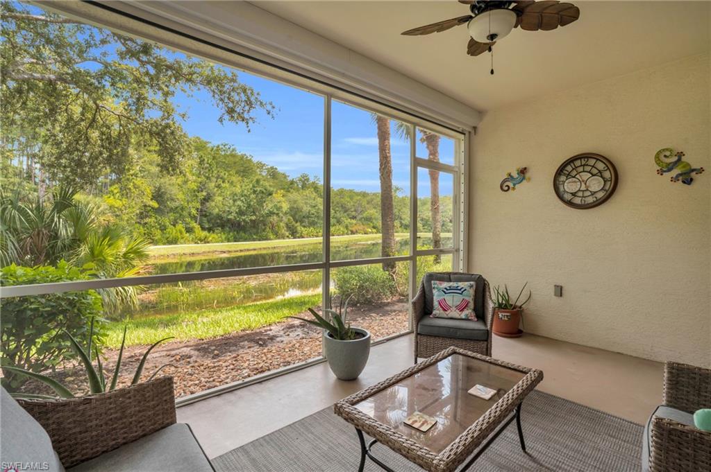 Sunroom with ceiling fan including a newline installed electric hurricane shutter!