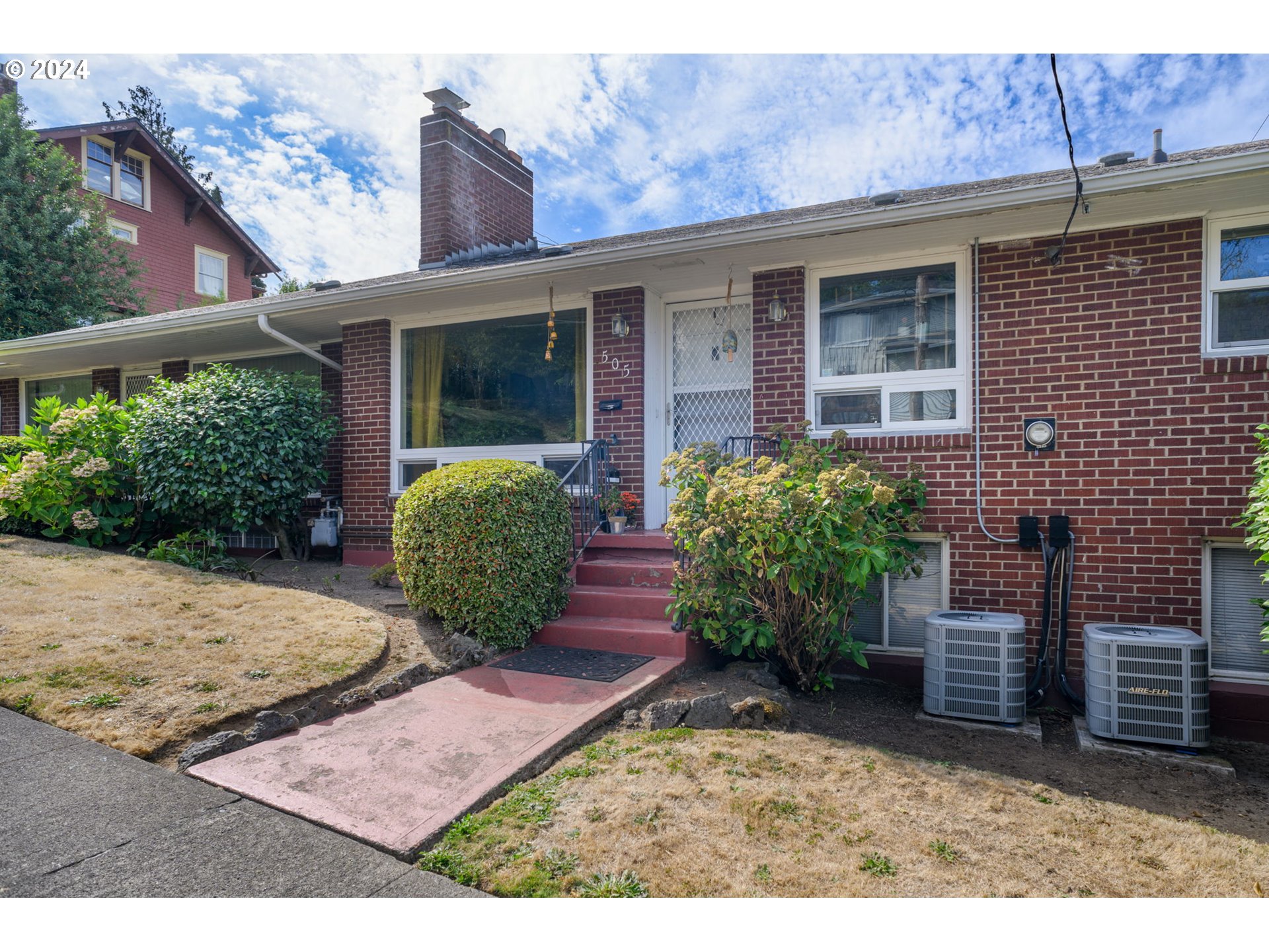 front view of a house with a yard