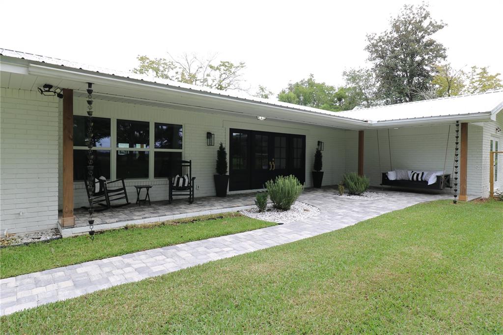 a view of a backyard with a patio