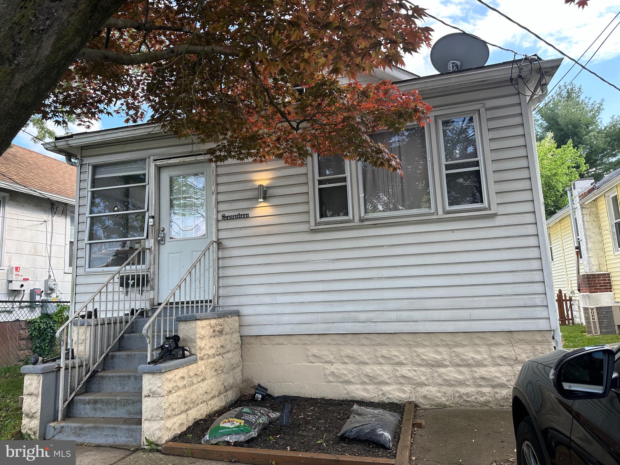 a front view of house with street