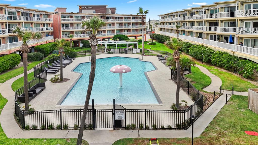 a view of swimming pool from a balcony