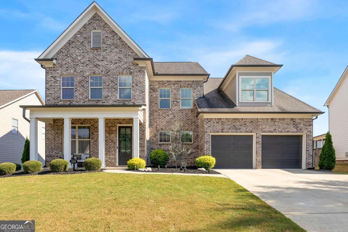 front view of a house with a yard