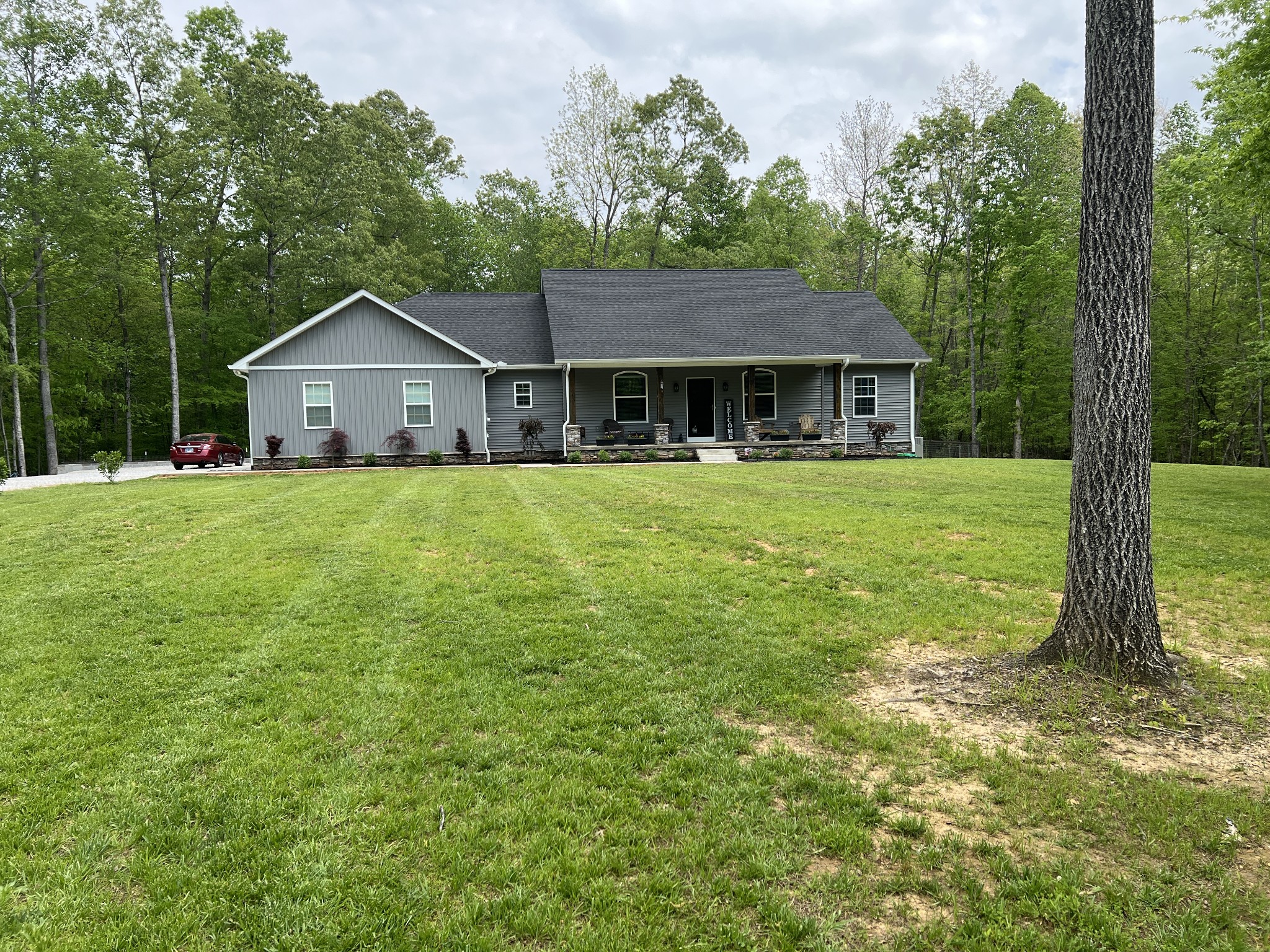 a front view of a house with a yard