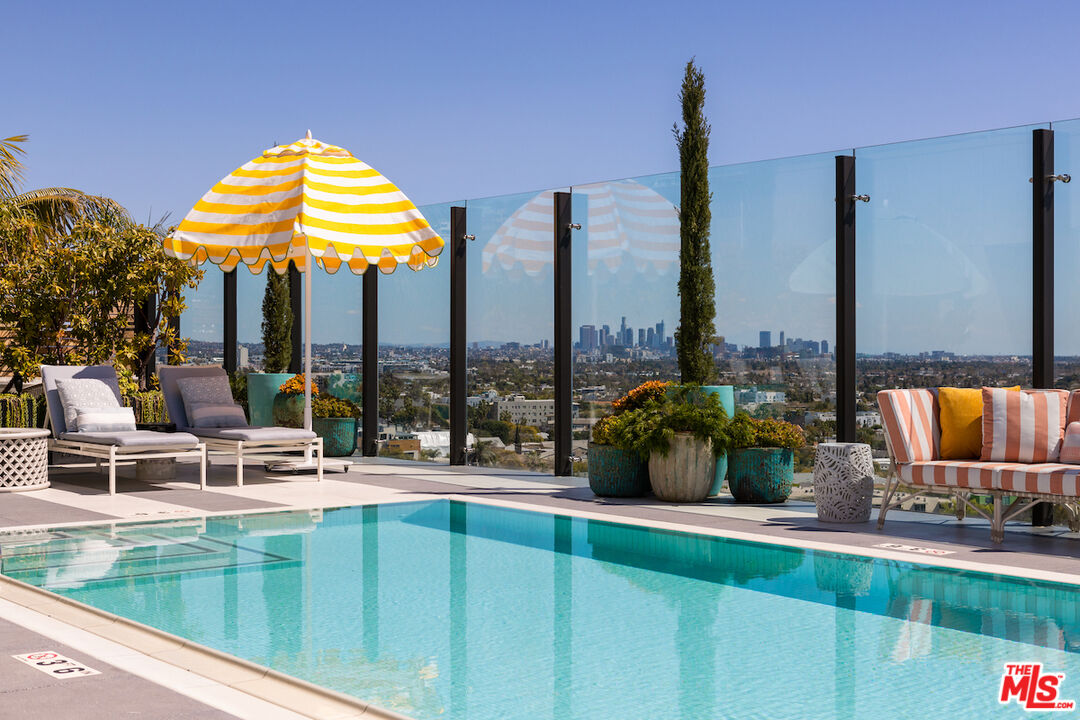 a view of a swimming pool with a lounge chairs