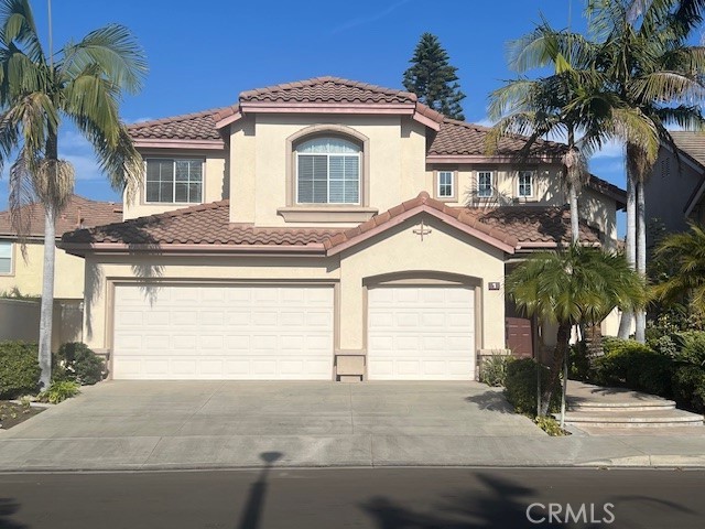 a front view of a house with garage