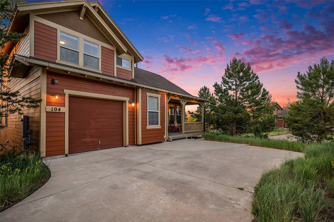 View of front facade featuring a garage