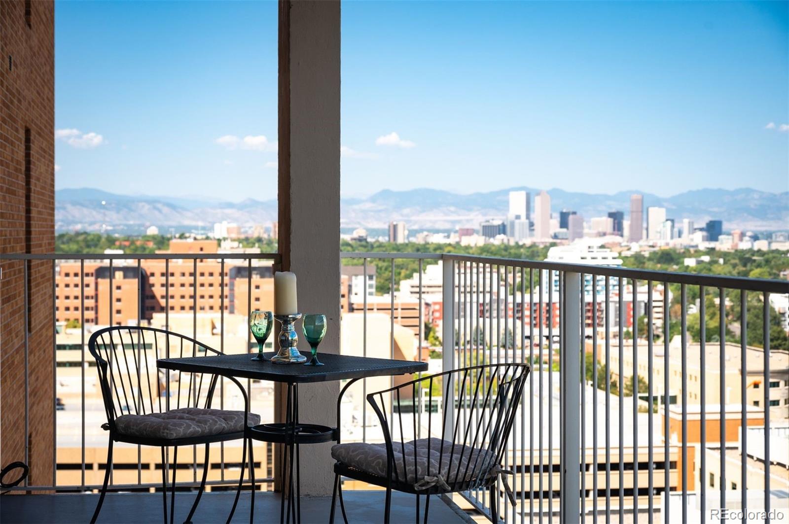 a view of a balcony with city view