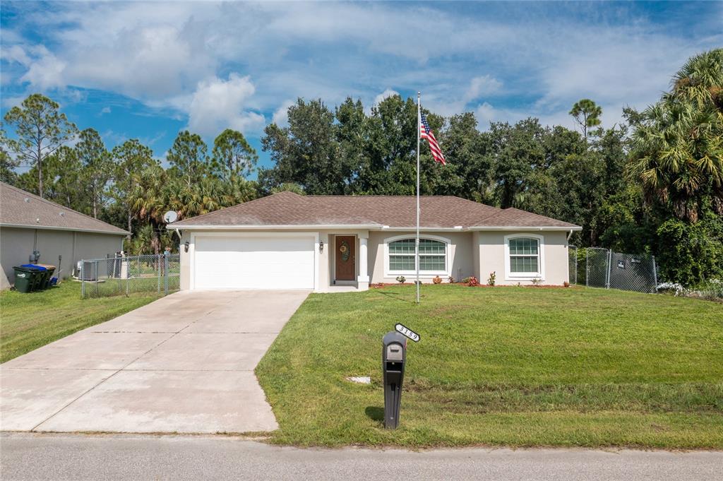 front view of a house with a yard