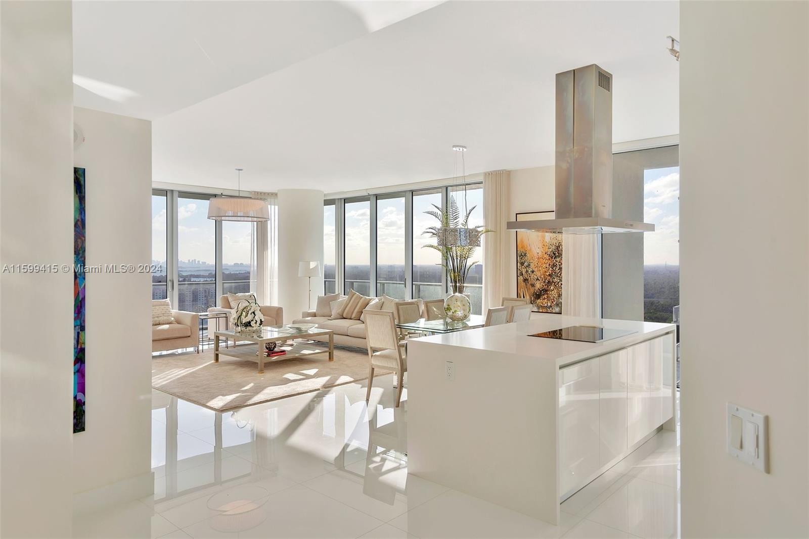 a very nice looking living room with a large window and a dining table with garden view