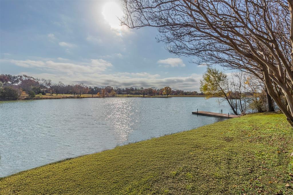 a view of a lake with houses in the back