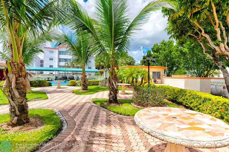 a view of a swimming pool with a patio