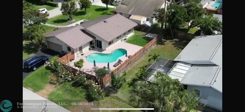 an aerial view of a house with a garden