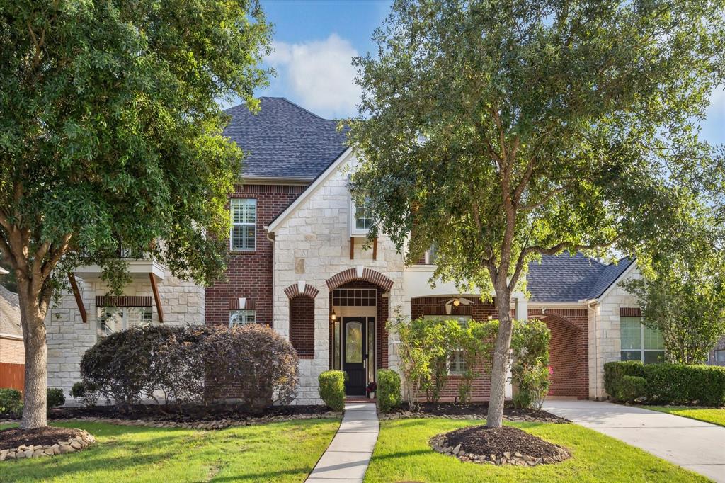 Stunning stately 4 Bedroom, 3.5 Bathroom home ideally located in the gated section of the lake front community of Waters Edge of Lake Houston