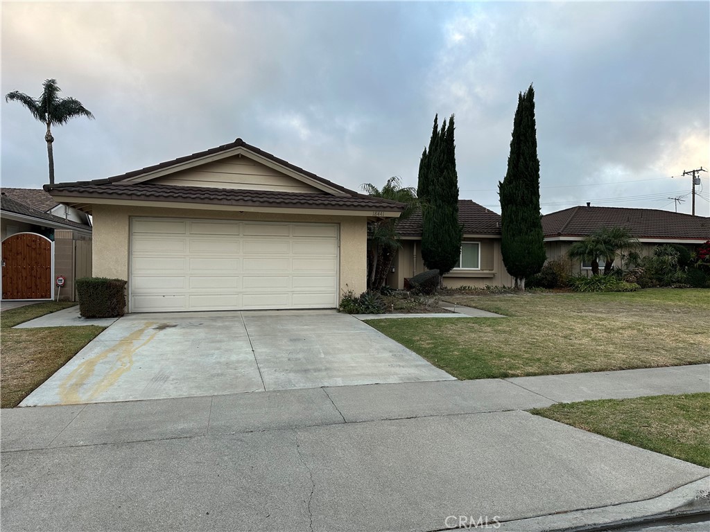 a front view of a house with garage