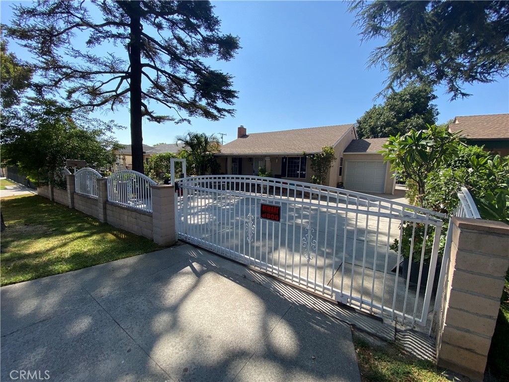 a view of balcony with wooden fence and trees