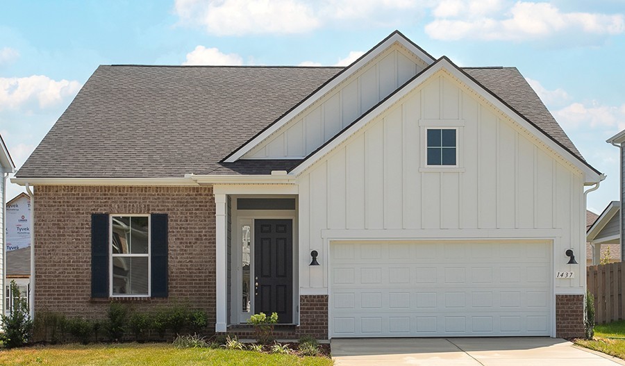 a view of house with yard