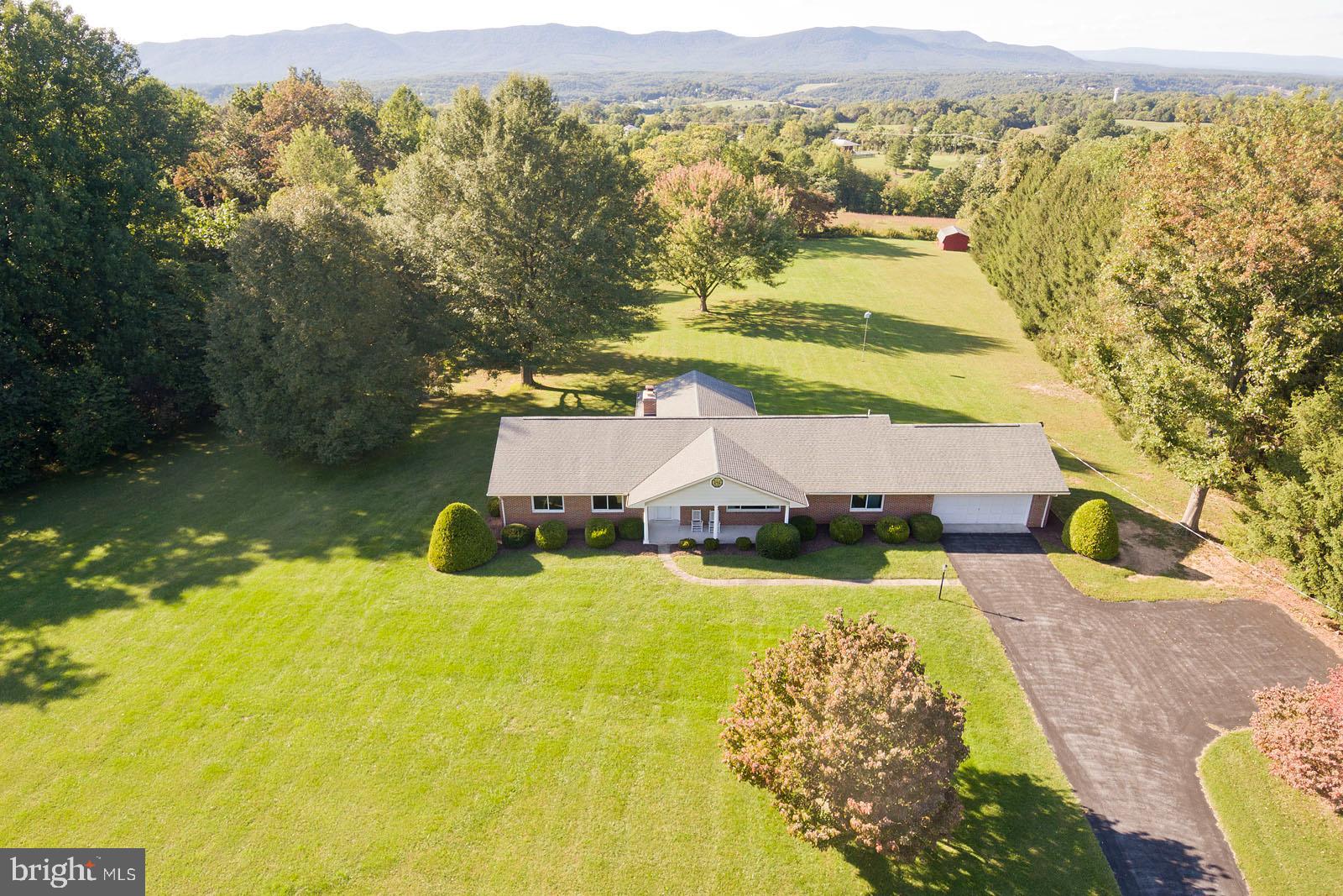 a view of a house with a big yard