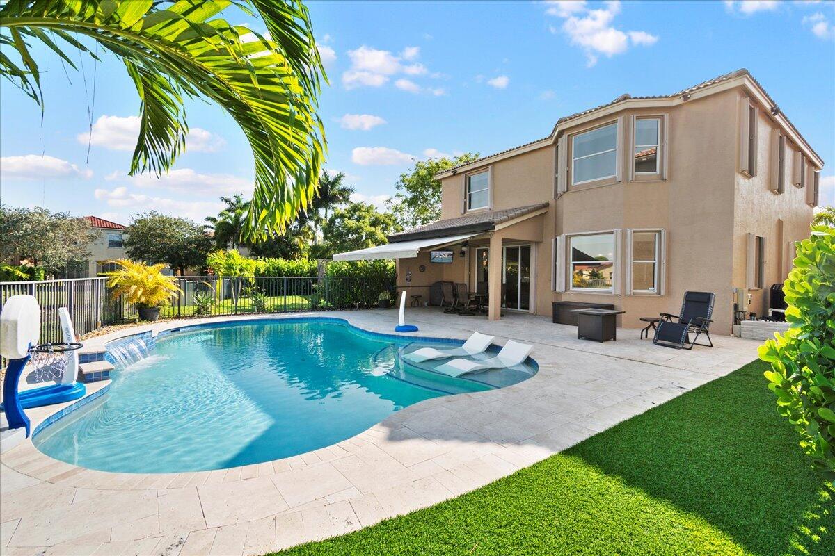 a view of a house with swimming pool