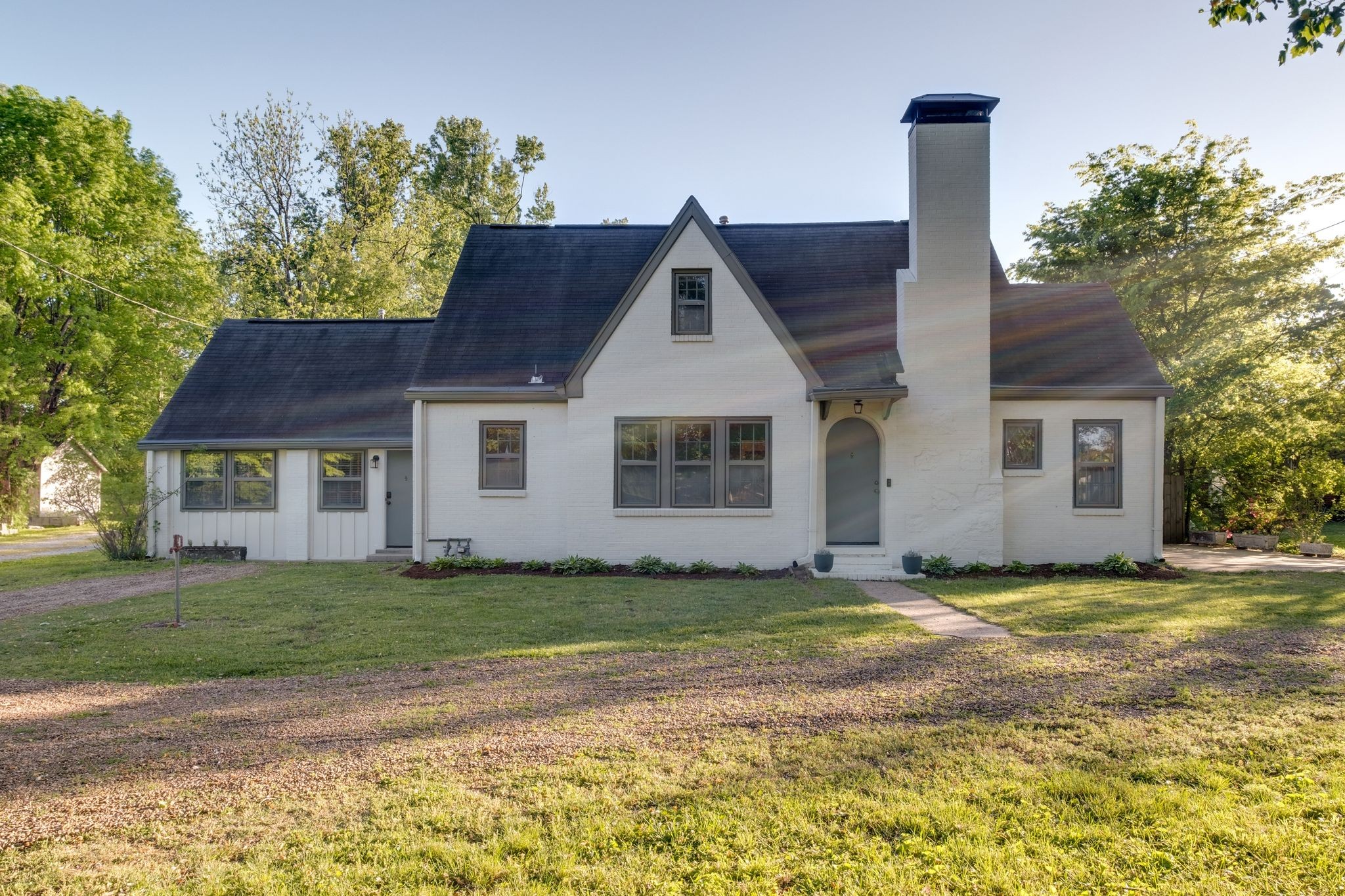 a front view of a house with a yard