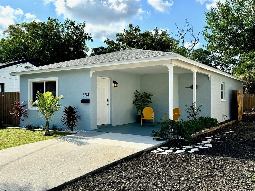 a front view of a house with garden