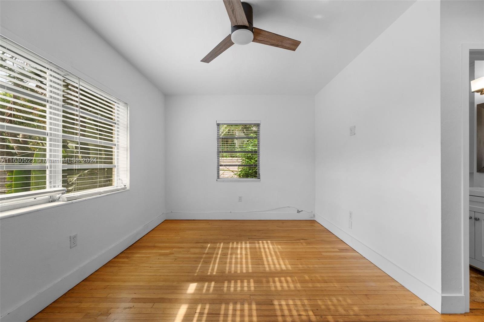 a view of empty room with windows