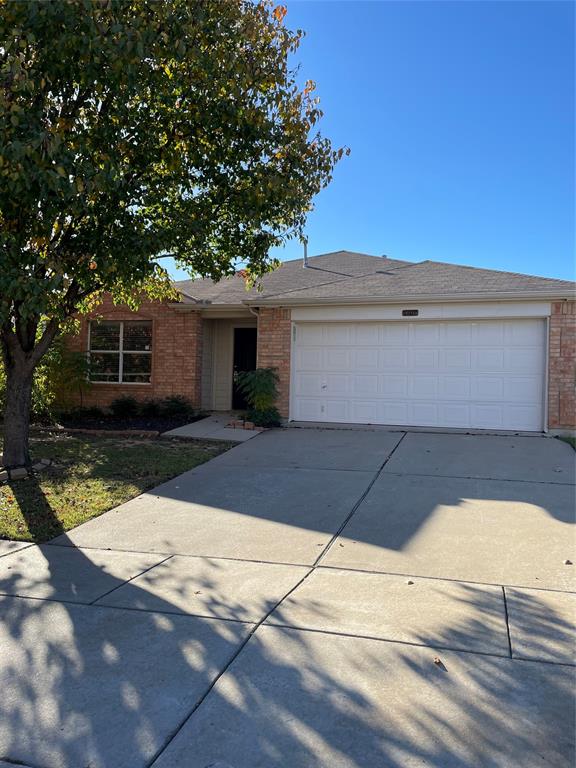 a view of house with garage