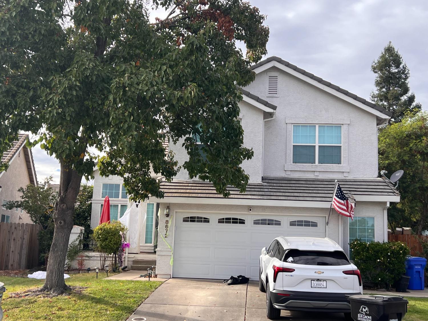 a front view of a house with a garage