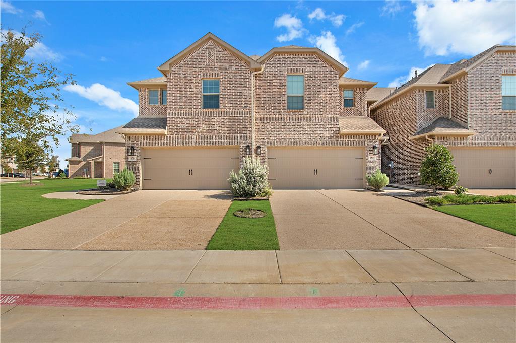 a front view of a house with yard