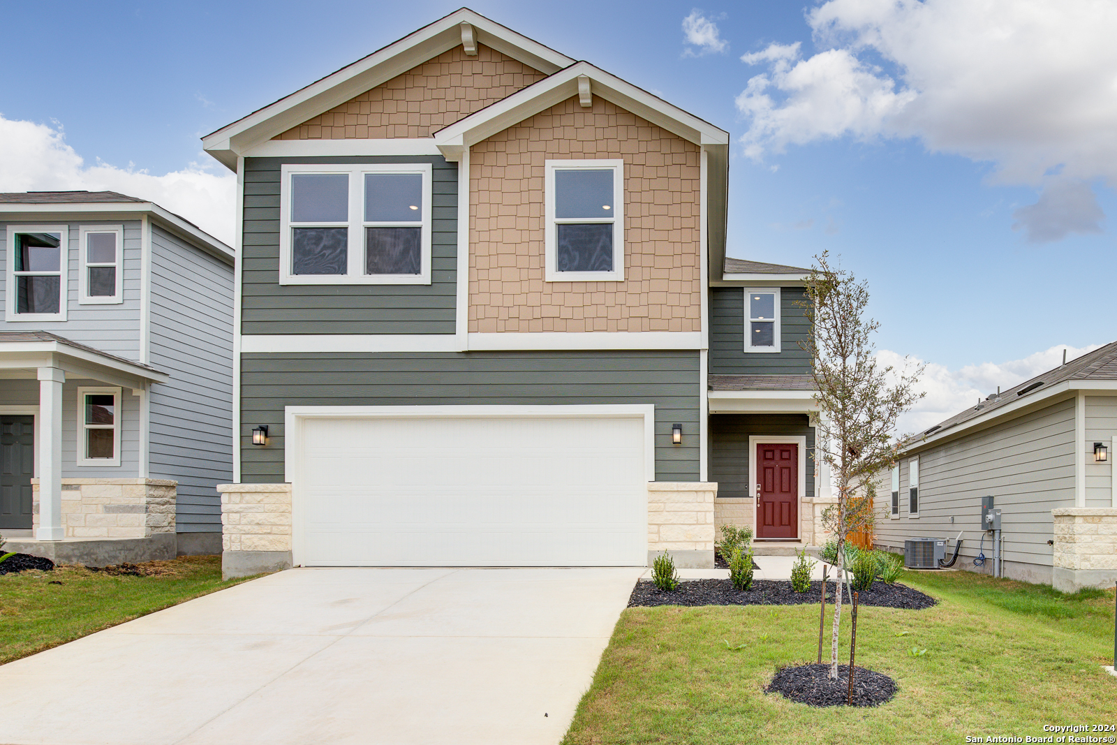 a front view of a house with a yard