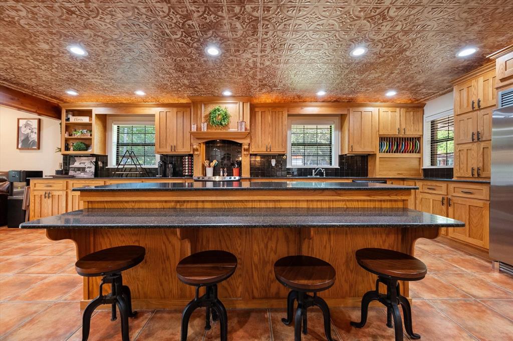 a large kitchen with lots of counter space and windows