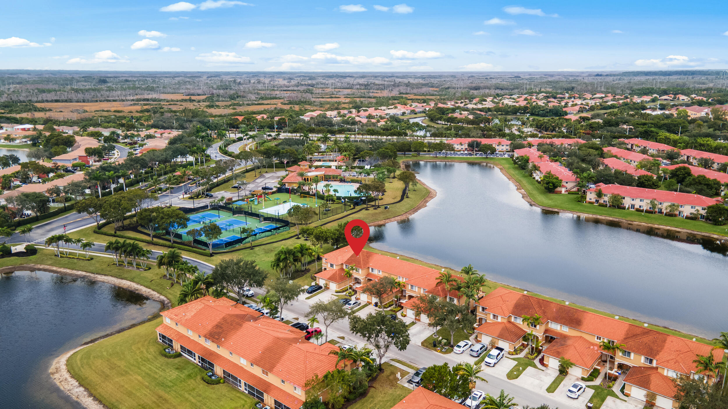 an aerial view of a residential houses with outdoor space