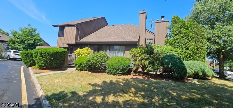 a view of a house with potted plants