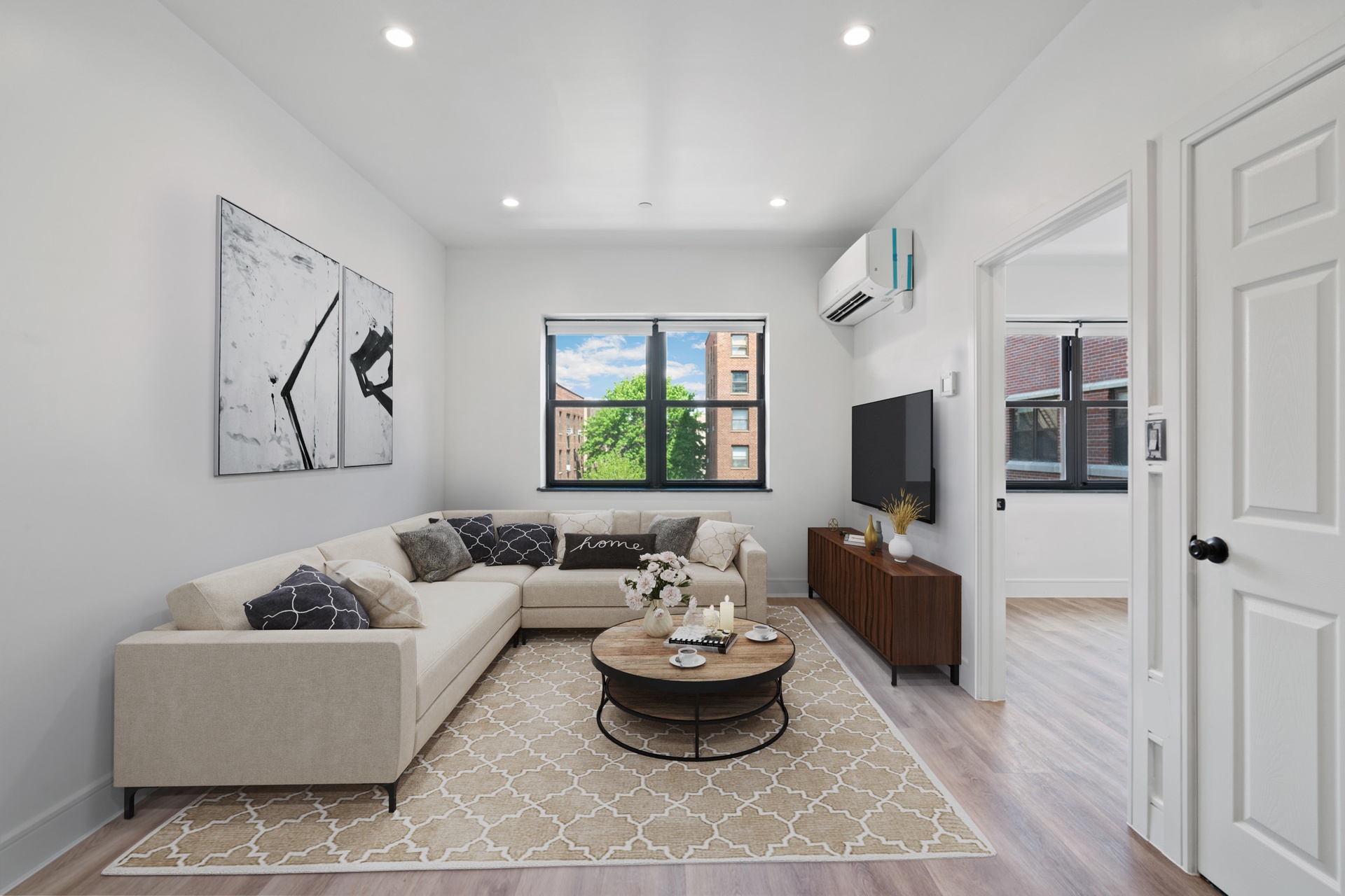 a living room with furniture and a flat screen tv