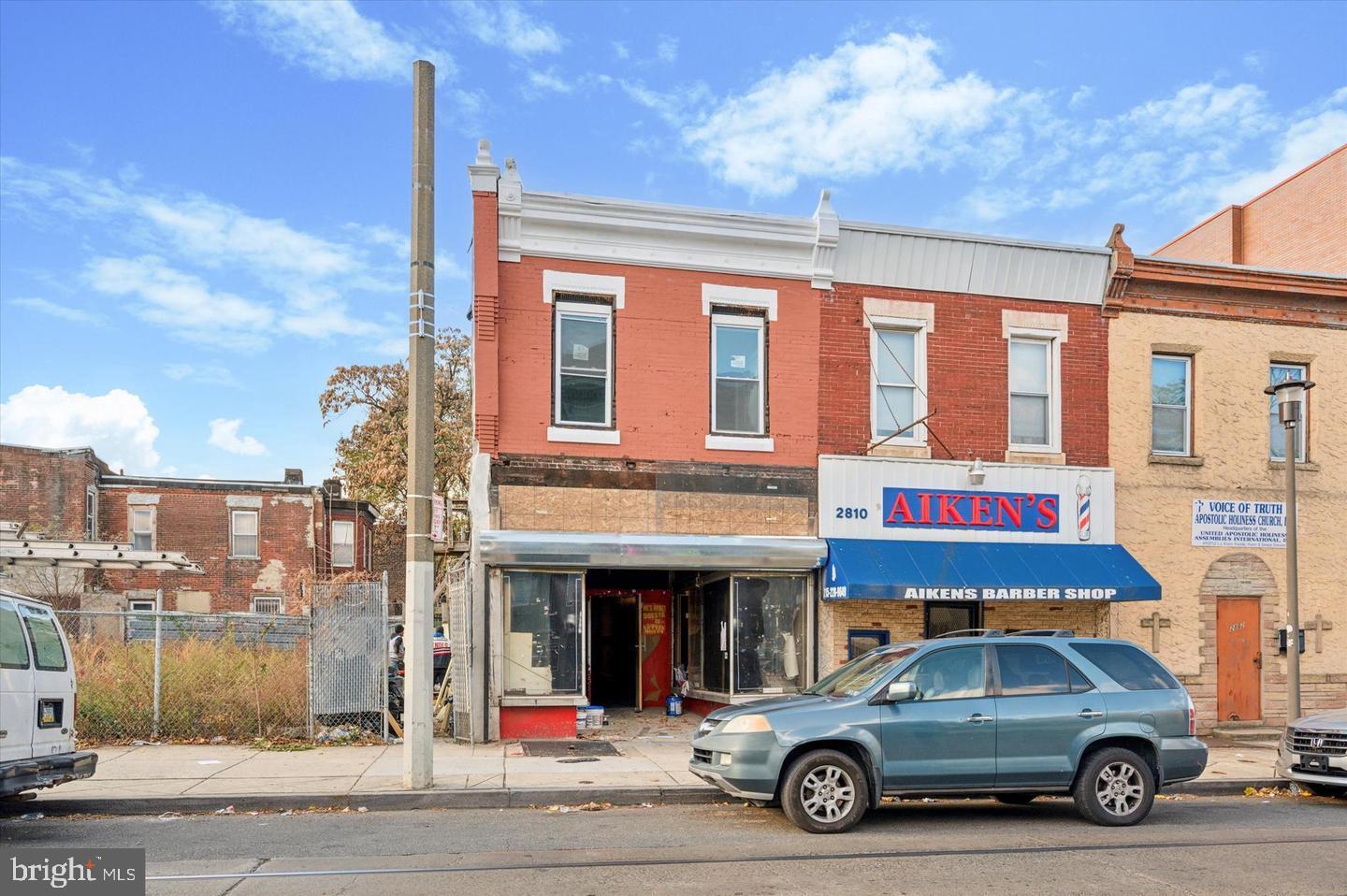 a view of a car parked in front of a building