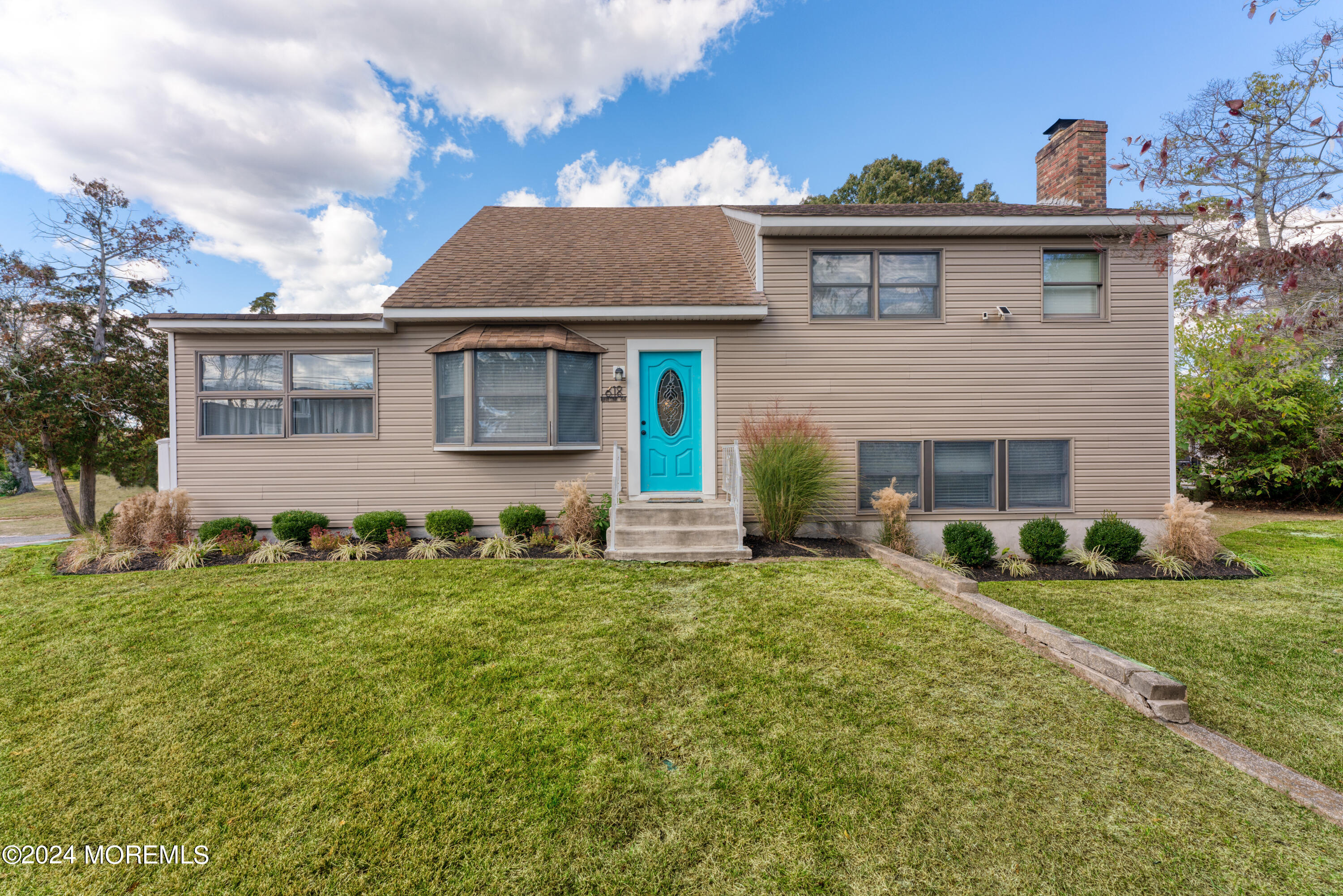 front view of a house with a yard