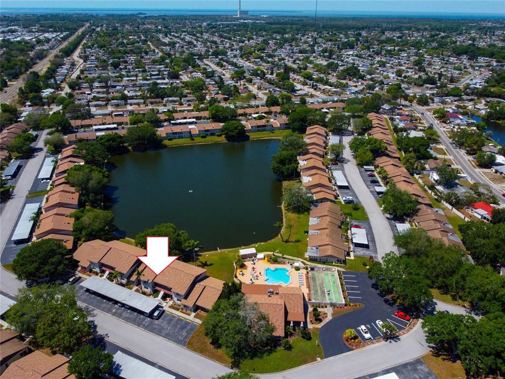 an aerial view of a house with a swimming pool outdoor seating and yard