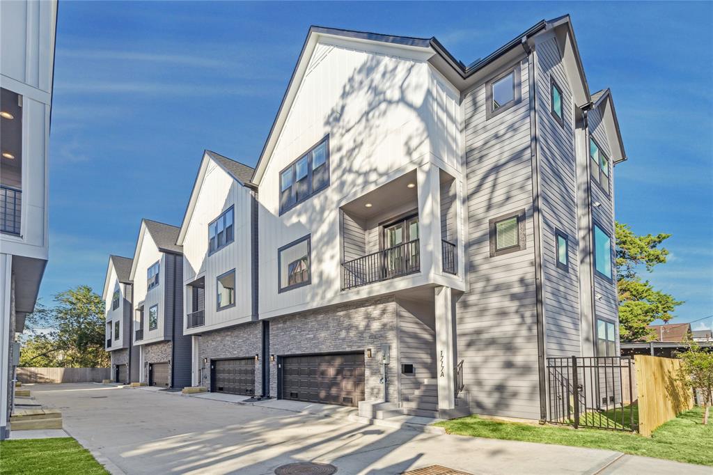 Each home offers a stunning two-toned Hardie exterior in Peppercorn Gray and Pure White, complemented by elegant stonework around the double car garage.