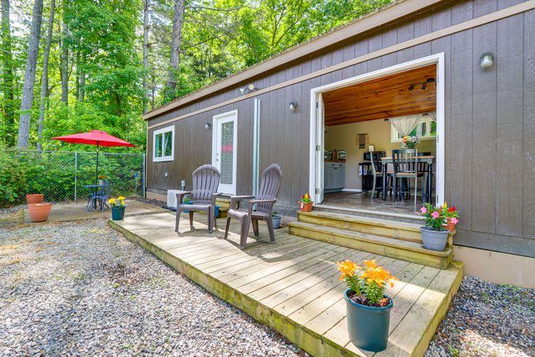 a view of a house with backyard and sitting area