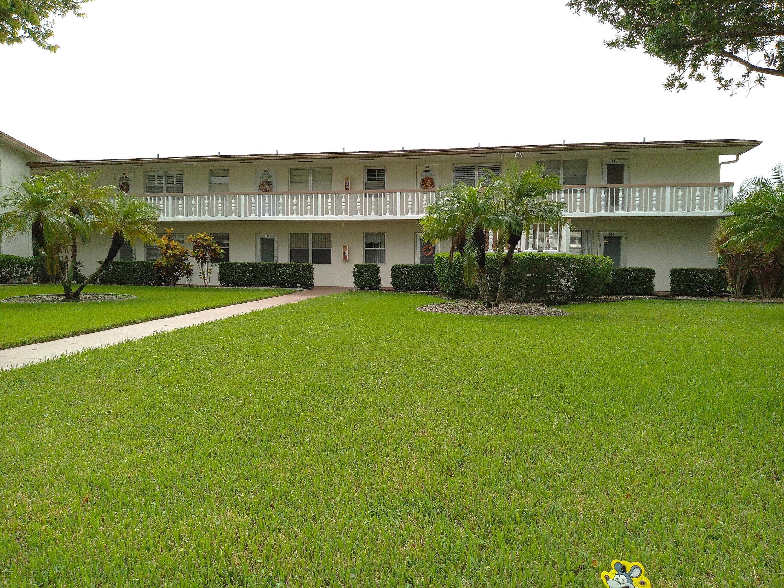 a view of building with yard