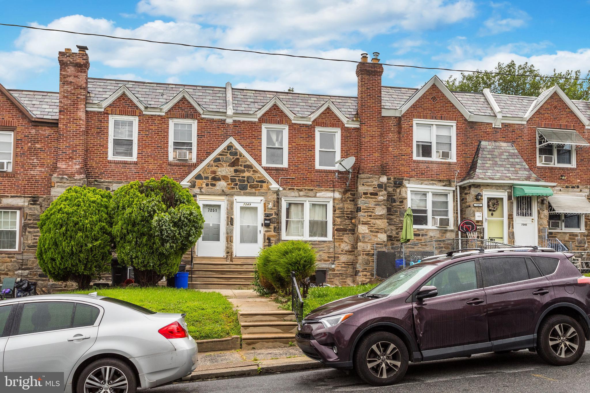 a front view of a house with parking space