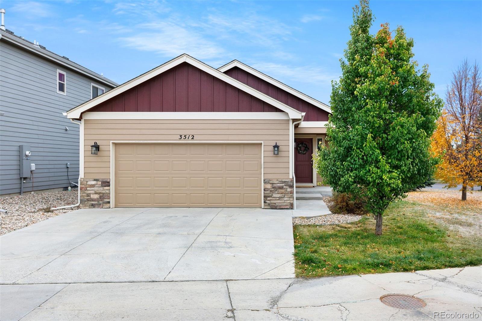 a front view of house with garage and yard