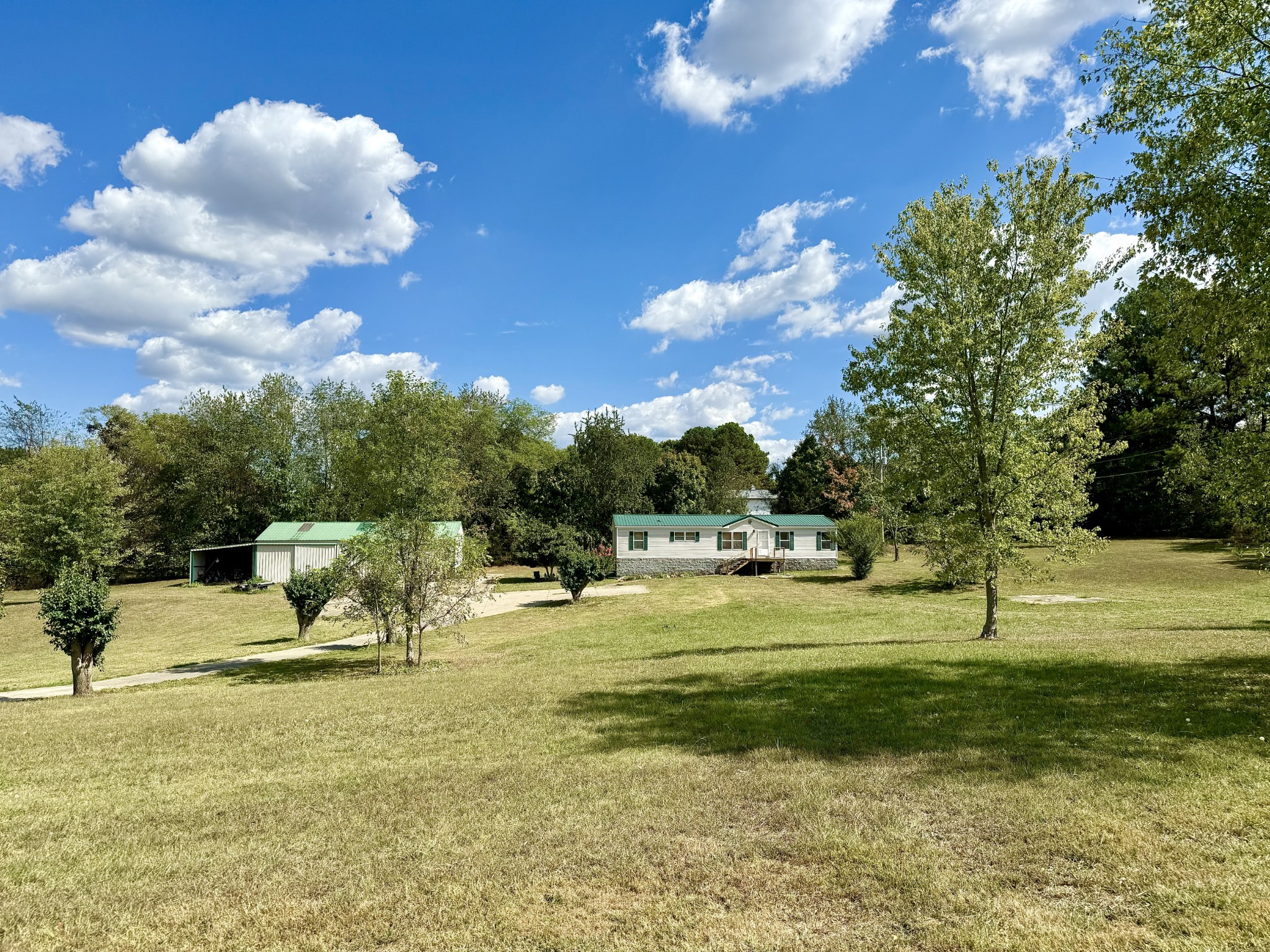 a view of a playground with a house