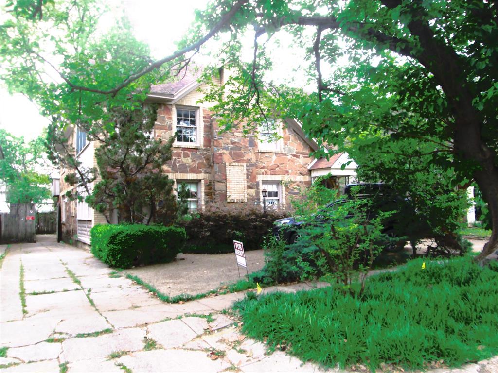 a view of a front of a house with a yard