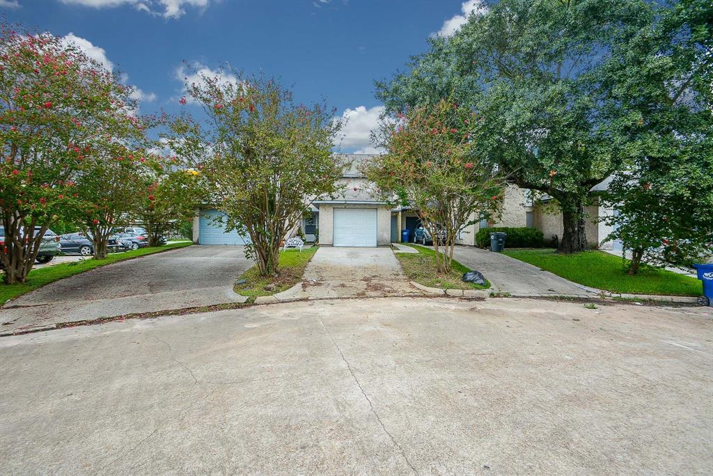 Welcome to this charming two-story home featuring an attached garage, nestled in a serene setting with mature trees.