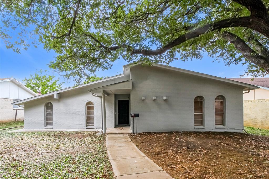 a house with a tree in front of it