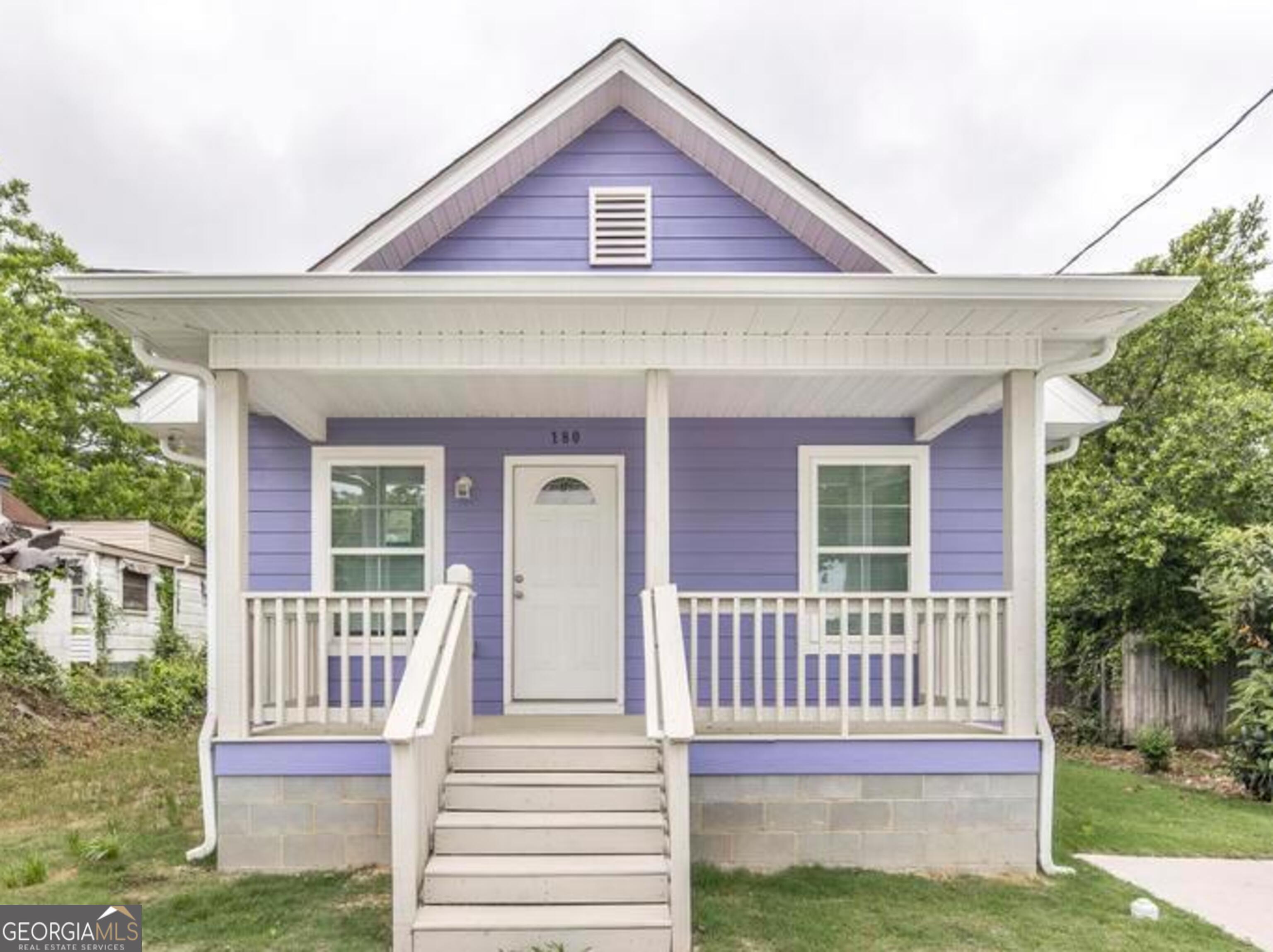 a front view of a house with a porch