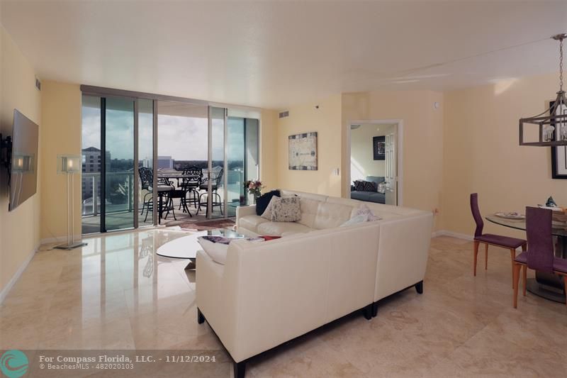 a living room with furniture and a table